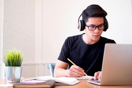 online-learning-boy-wearing-spects-front-of-laptop