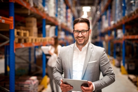portrait-successful-middle-aged-manager-businessman-holding-tablet-computer-large-warehouse-organizing-distribution.jpg